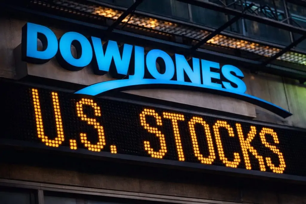 Dow slips from record close as tech rally cools in year-end trade