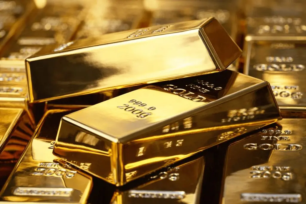 Gold price slips from record highs as U.S. data lifts dollar, Fed meeting looms