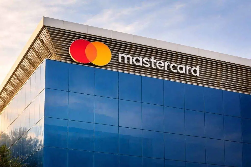 Mastercard stock jumps after earnings beat and 4% job-cut plan; traders eye AmEx next