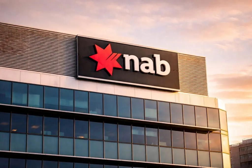 National Australia Bank share price holds near highs after Q1 update; brokers lift targets, but capital stays in focus