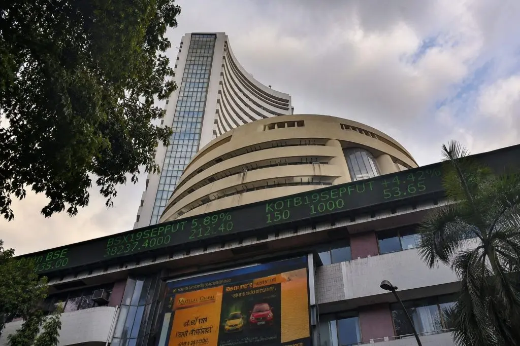 Sensex edges higher as oil slips, rupee firms