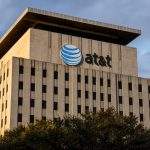 AT&T shares dip as fiber build-out runs into legacy line disputes