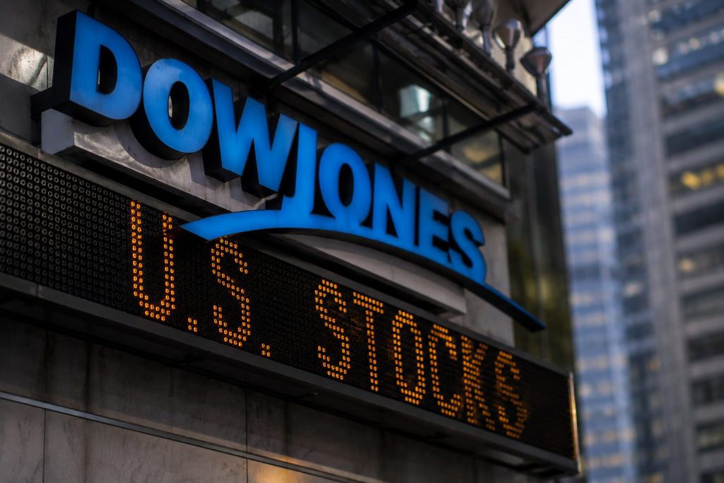 Dow turns up for week as tech slide stops Dow at 52,000 again