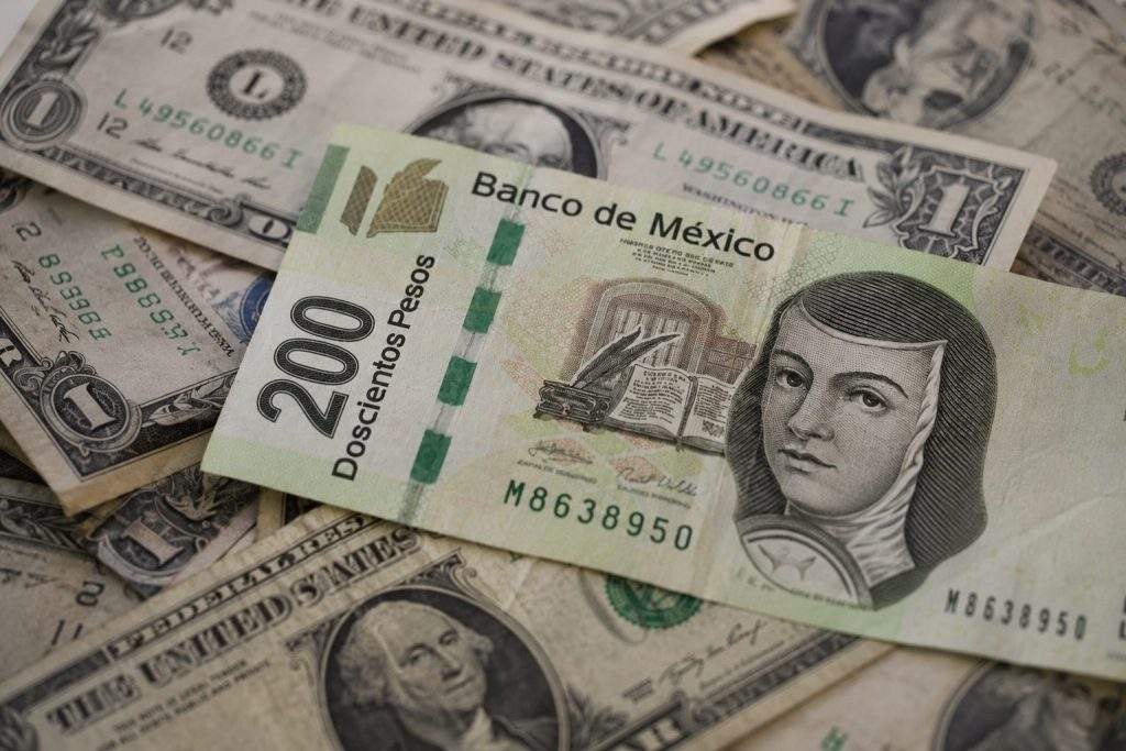Peso falls after U.S. jobs surprise resets Fed expectations