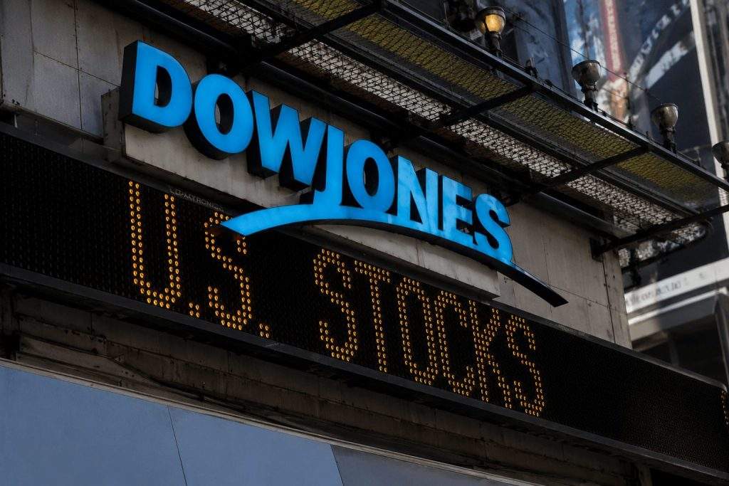 Dow jumps to record as oil drops and Fed in focus