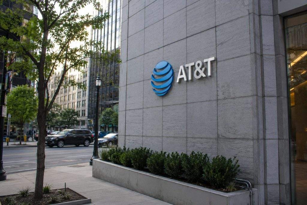 AT&T shares slide as trading jumps, spectrum move puts income appeal to test
