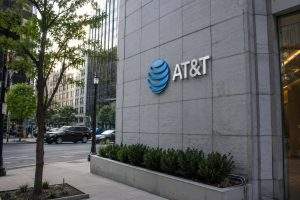 AT&T shares slide as trading jumps, spectrum move puts income appeal to test