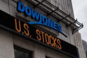 Dow Jones live: Small decline masks 936 points of single-stock swings