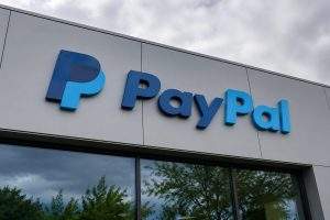 PayPal (NASDAQ:PYPL) Lifts 2026 Guidance; Share Buybacks Offset 11% Fall in Adjusted Profit
