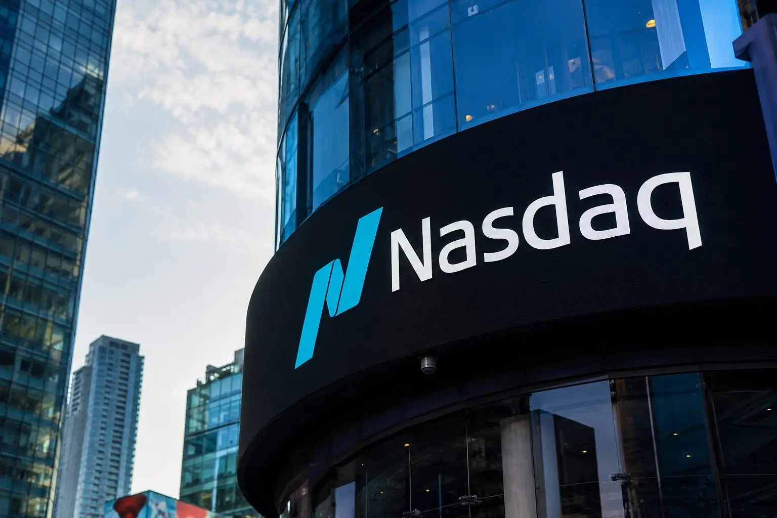Nasdaq slips on chip slump; Dow flat near record high