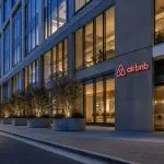 Airbnb (NASDAQ:ABNB) Shares Reach Four-Year Peak Amid Improved Growth Forecast Linked to AI