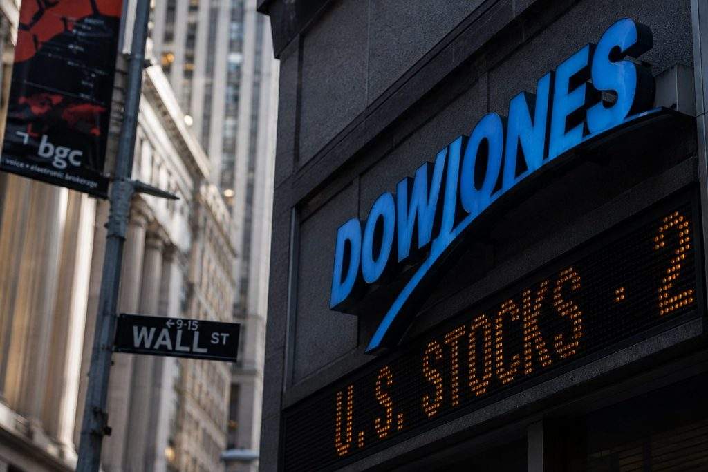 Dow sinks 454 points on steeper losses in six key stocks due to price-based index weighting