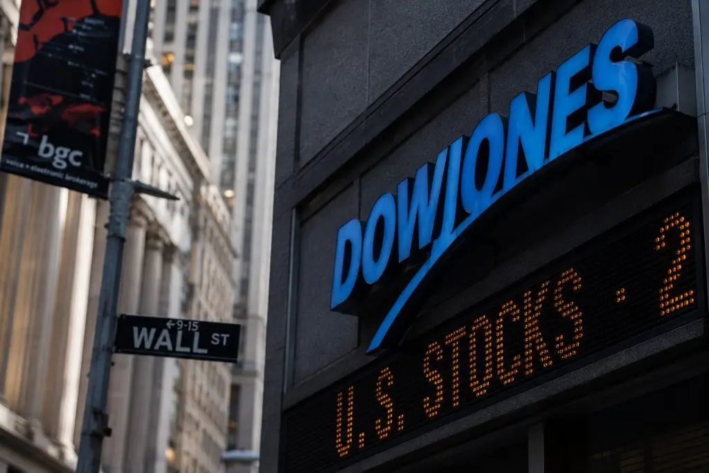 Dow sinks 454 points on steeper losses in six key stocks due to price-based index weighting