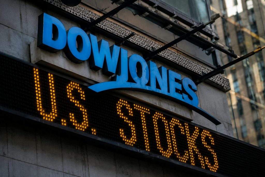 Dow exceeds 54,000, with Caterpillar and Goldman contributing roughly 60% of surge